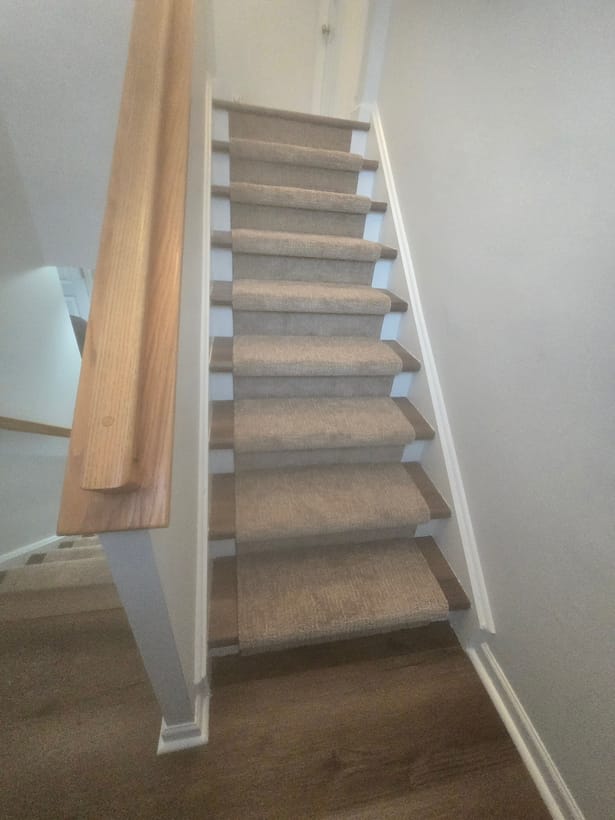 Custom carpet stair runner over hardwood by Frankie D’s Flooring