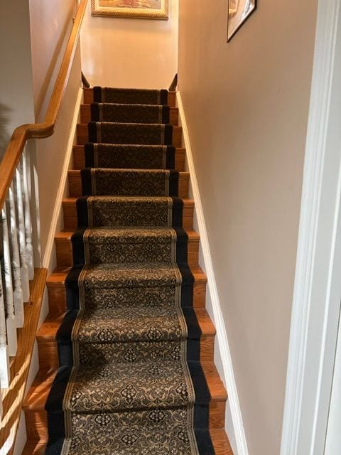 Patterned runner on oak stairs